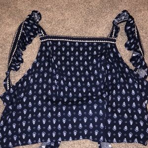 cropped backless shirt.